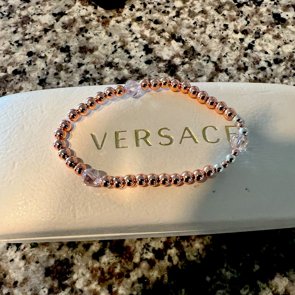 Rose gold stackable bracelets.